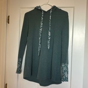 Lovely Melody tunic with cute paisley detail. Size small